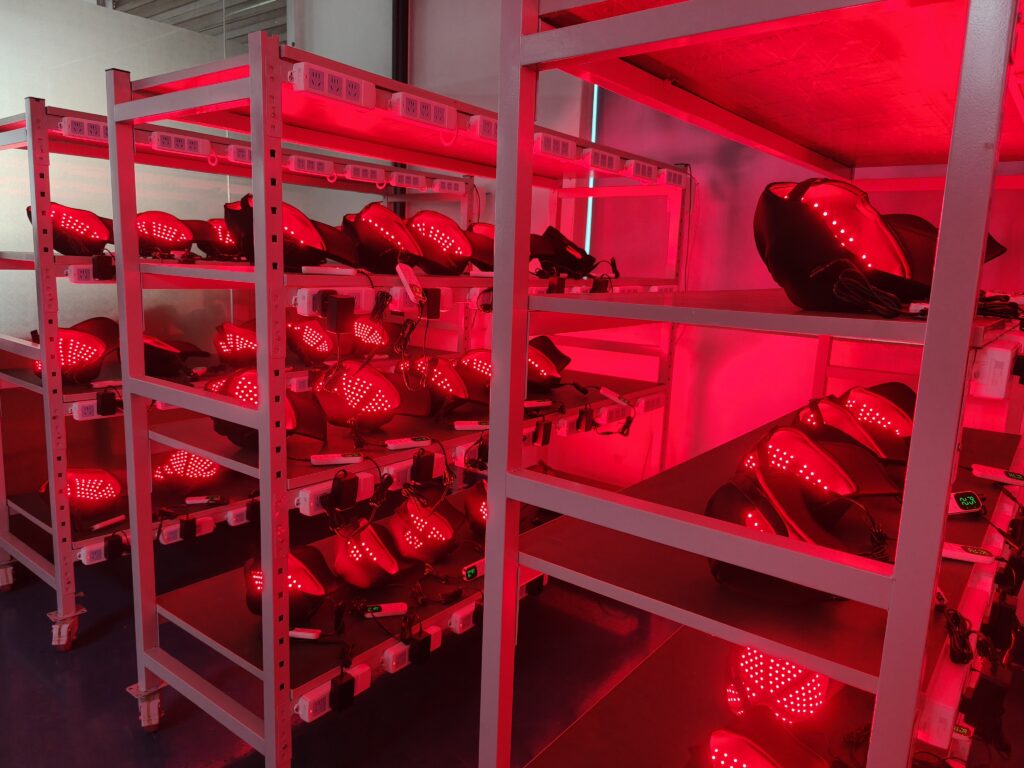 Red light products illuminated on workshop racks