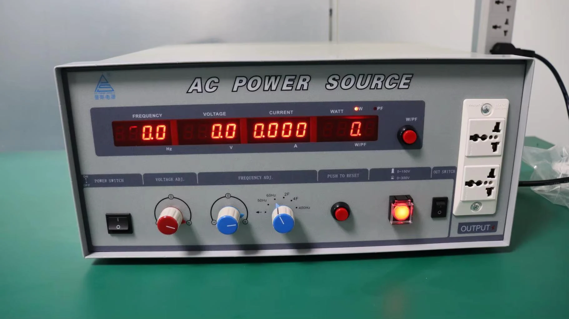 Front panel of an AC power source used for electrical setups.