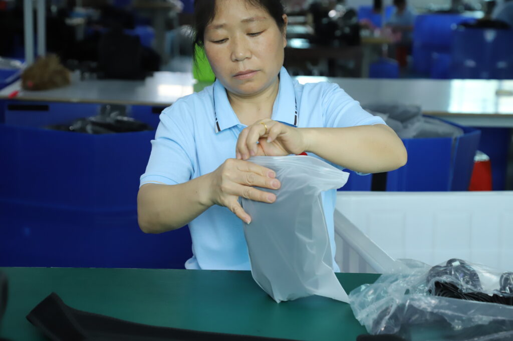Hands placing a flexible product in a protective bag